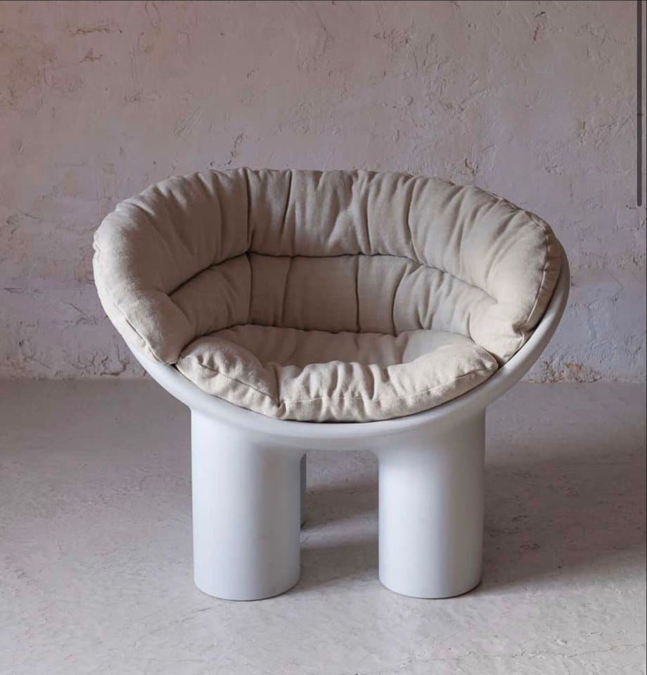 Close detail of the ECHO chair surface showing smooth hand-finished fiberglass